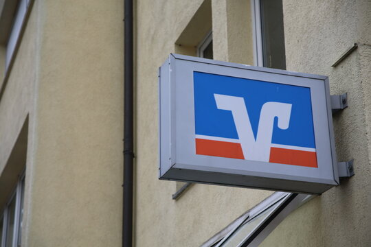 Leipzig, Germany - March 7. 2021: Closeup of volksbank logo lettering above entrance (focus on lettering left)