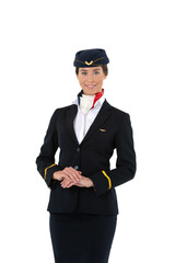 Obraz na płótnie Canvas Beautiful smiling female flight attendant in dark blue uniform standing isolated on white background