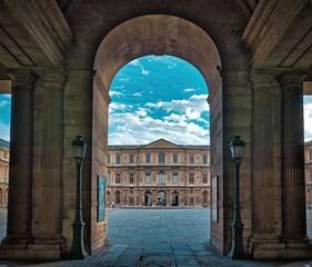 Louvre archway clouseup view in Paris. With over 60k sqM of exhibition space, Louvre is the biggest Museum in Paris.