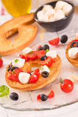 Friselle with tomatoes and mozzarella cheese.