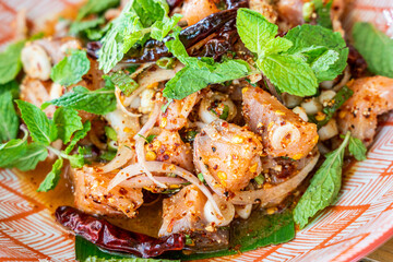 Thai style spicy salmon salad with herb.