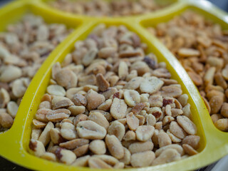 salted peanuts in spices on the table in a bowl