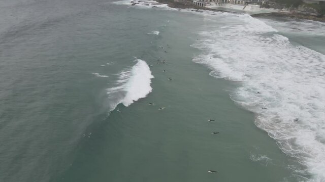 Foamy Waves With Surfers On Summer At Bondi Beach In Sydney, New South Wales, Australia. - Aerial Drone Shot
