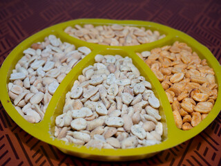 salted peanuts with different spices on the table. beer snack