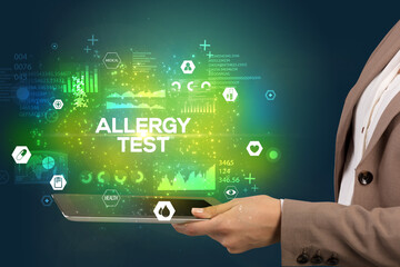 Close-up of a touchscreen with ALLERGY TEST inscription, medical concept