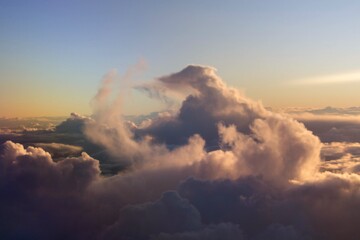 Obraz premium spectacular sunset seen from an airplane with clouds in the foreground and in the distance 