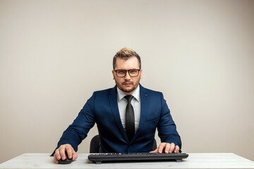 Male businessman working on laptop in the office. Business development concept.