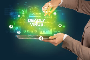 Close-up of a touchscreen with DEADLY VIRUS inscription, medical concept