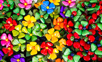 Fototapeta na wymiar Bunches of colorful flowers made with typical Sulmona's confetti (sugar coated almonds), Abruzzo region, central Italy 