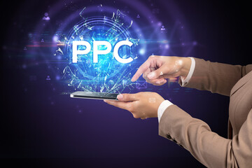 Close-up of a touchscreen with PPC abbreviation, modern technology concept