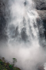Close up of water flowing from Upper Yosemite Falls smashing on the rock walls, Yosemite National Park, California