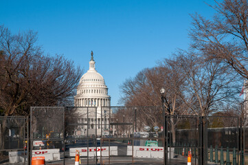 The National Capitol Building behind fences and razor wire, Washington DC, March 7th, 2021