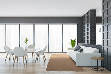Living room with sofa and table with chairs