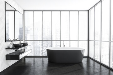 Fototapeta na wymiar Two sinks and grey bathtub, panoramic windows