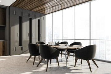 Kitchen interior with dark furniture near window