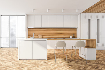 Kitchen interior with light furniture near window