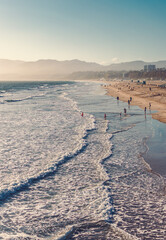 Sunset view with silky sky and golden beach of California, Santa Monica. A summer day