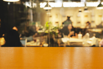 Blur coffee shop or cafe restaurant with abstract bokeh light image background. People in store Blur Background or design key visual layout