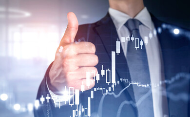 Businessman give a thumb up, double exposure with candlesticks g
