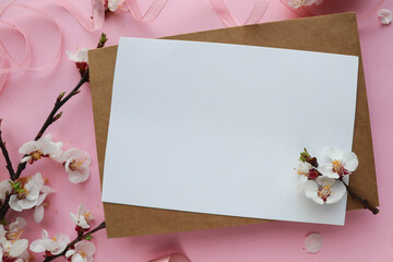 postcard mockup. floral frame of spring flowers, envelope and white blank for text 