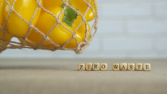 Eco friendly department. Yellow pepper in an eco string bag. Zero waste.