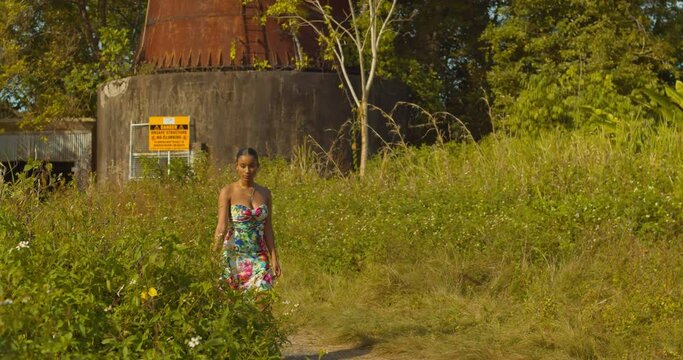 Sexy African Queen walking in a flower garden on the Caribbean island of Trinidad