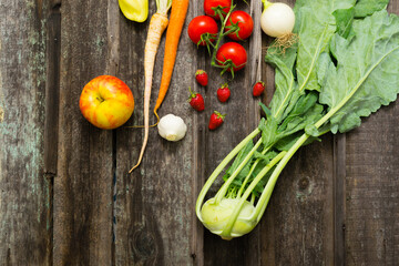 fresh fruits and vegetables on weathered wooden