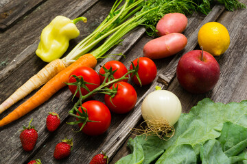 fresh fruits and vegetables on old weathered wooden