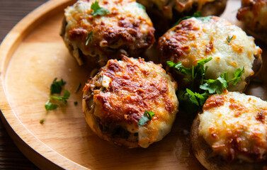 Puff basket with mushrooms in creamy sauce and cheese on wooden background