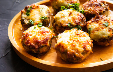 Puff basket with mushrooms in creamy sauce and cheese on wooden background