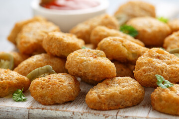 Crispy Jalapeno Popper with creamy cheese battered on white wooden board
