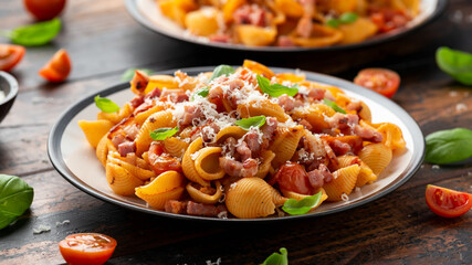 Conchiglie alla Amatriciana pasta with pancetta bacon, tomatoes and pecorino cheese. Healthy Italian food