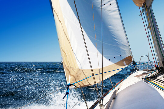 Sailing boat at open sea on a bright sunny day