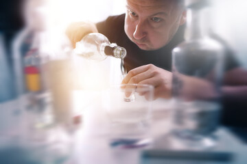 drunk man addicted to alcohol with vodka in a glass