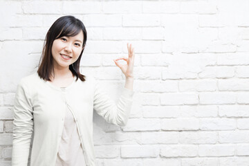 Woman expressing OK sign (gesture)