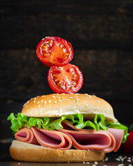 sandwich sausage burger lettuce leafб vegetablesб salami ham, tomato snack meal top view copy space for text food background rustic image