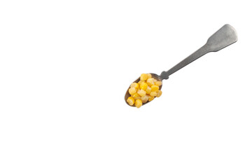 sweet canned corn in a small spoon isolated on a white background top view copy space