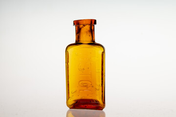 Antique poison medicine bottles on white background
