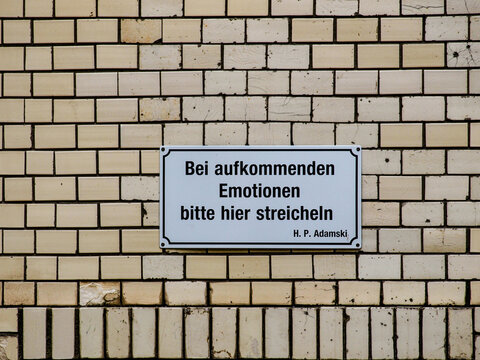 sign on a brick wall 