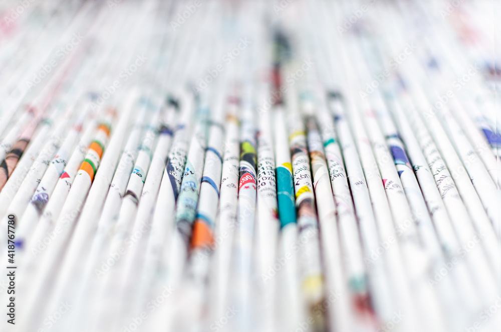 Fototapete paper rolled up in tubes folded as a background with a shallow depth of field