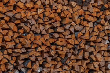 Stacked firewood on the wall.