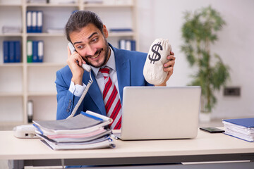 Fototapeta premium Young male employee in remuneration concept
