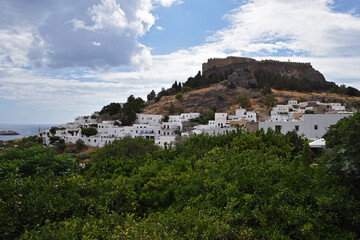 Fototapeta na wymiar Beautiful view of the city on the hill, white houses, castle, ramparts