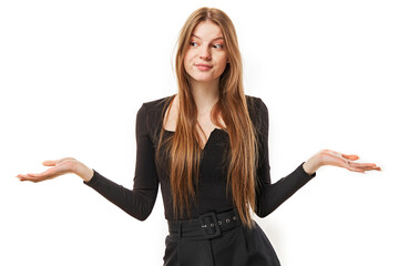 portrait of surprised young girl throwing up her hands and shrugging shoulders