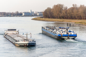 Barge boat sailing on the Rhine between Germany and France - obrazy, fototapety, plakaty