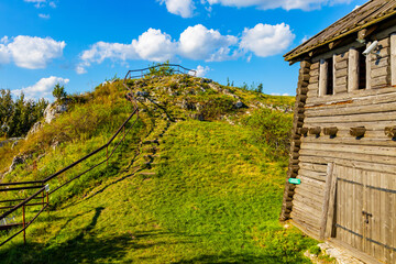 Obraz premium Wooden fortifications and inner courtyard of Gora Birow Mountain stronghold near Ogrodzieniec Castle, at Cracow-Czestochowa upland in Podzamcze of Silesia in Poland