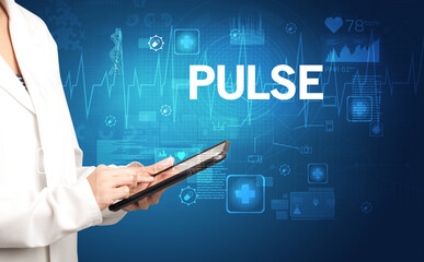 young doctor writing down notes with PULSE inscription, healthcare concept