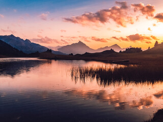 Stunning sunset over the lake up in the mountains a calm evening in the summer