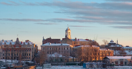ancient beautiful buildings of the city of the middle century old city of Vyborg in Russia  in winter sunset