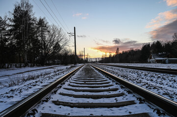 Fototapeta premium Winter sunset in the railway.